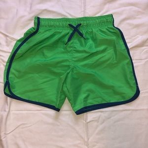 Lime green and blue swim trunks